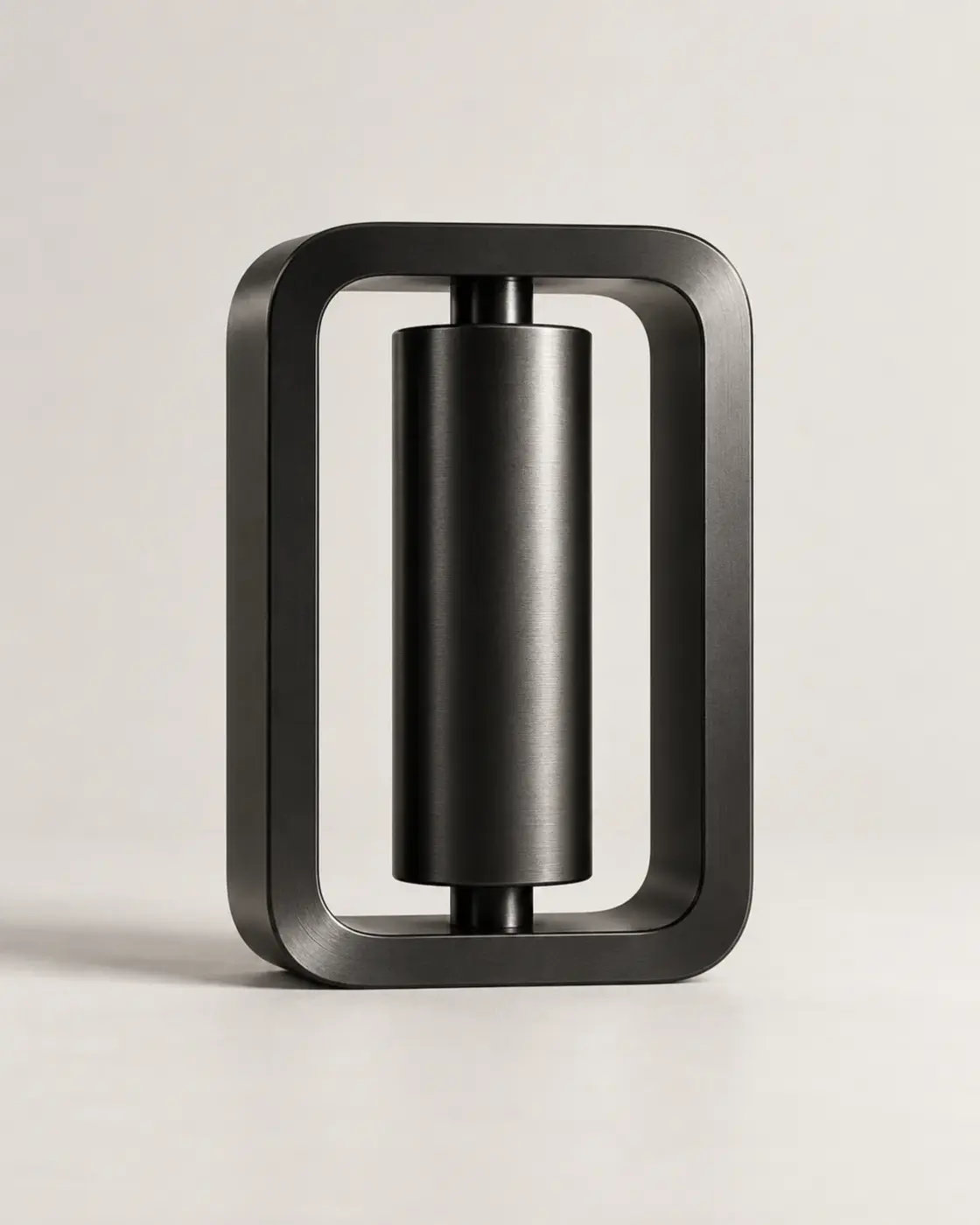 Abstract black metal sculpture on a pale background. Sample image, not a real product.